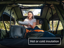 Person inside a TentBox, taking a fresh takeaway out of the insulated CoolBag. With text 'Hot or cold insulation'.