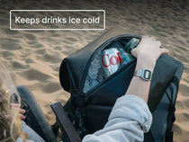 Person placing a can of Coke into the TentBox CoolBag on a beach.