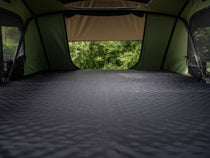 TentBox Lite XL rooftop tent interior with fully laid out mattress topper – spacious and ready for sleep