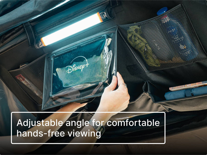 Hand holding a Disney+ branded screen in a car with text 'Adjustable angle for comfortable hands-free viewing'.
