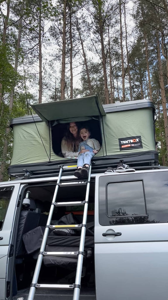 Young family sit inside the TentBox Classic 2.0 in Forest Green
